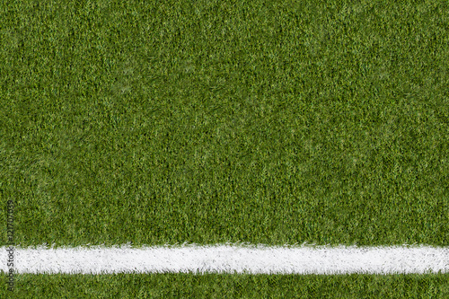 Further boundary line on green grass of sports field