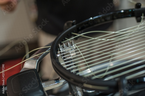 Racket stringing. Detail of tennis racket in the stringing machine