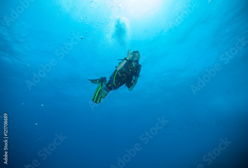 Young man scuba diver showing ok sign