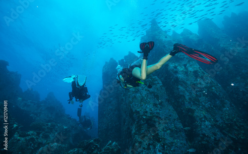 Group of scuba divers exploring sea bottom © Jag_cz