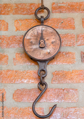 old scale weight, Hanging on the wall.

