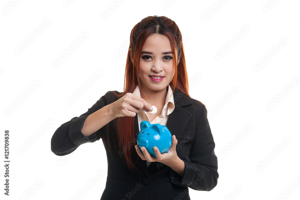 Asian business woman with coin and pig coin bank. Asian business woman with coin and pig coin bank.