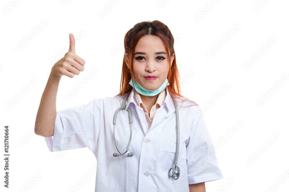 Young Asian female doctor show thumbs up.