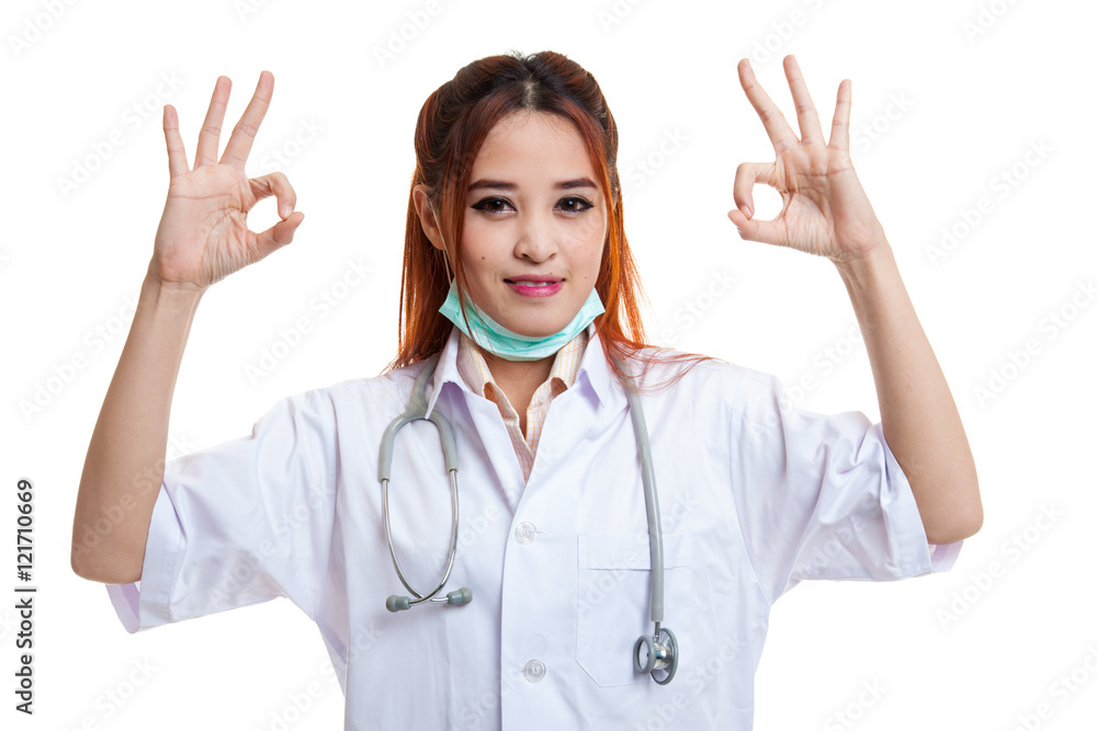 Young Asian female doctor show two OK sign. Young Asian female doctor show two OK sign.