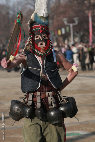 PERNIK, BULGARIA - JANUARY 30, 2016 - Masquerade festival Surva in Pernik, Bulgaria. People with mask called Kukeri dance and perform to scare the evil spirits