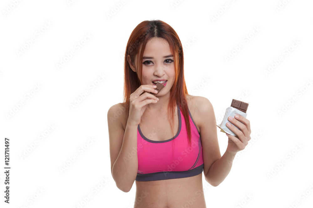 Beautiful healthy Asian girl eat chocolate. Beautiful healthy Asian girl eat chocolate.