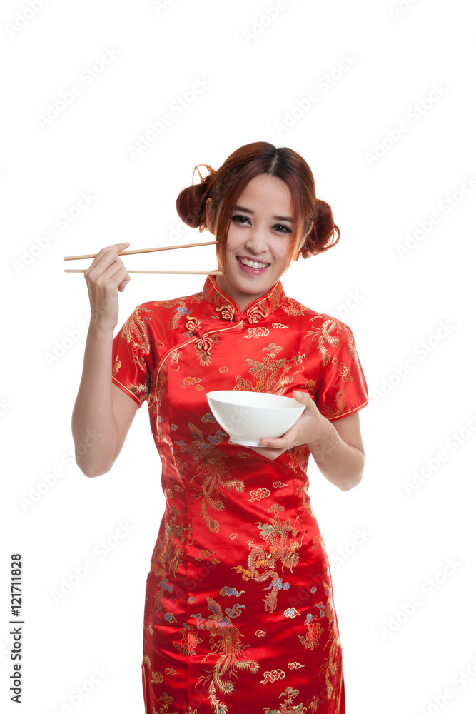 Asian girl in chinese cheongsam dress with chopsticks. Asian girl in chinese cheongsam dress with chopsticks.