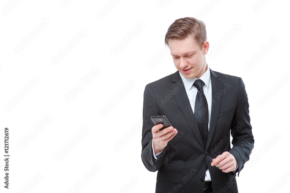Business and technology. Confident young man in suit and tie using smart phone. Isolated on white. Business and technology. Confident young man in suit and tie using smart phone. Isolated on white.