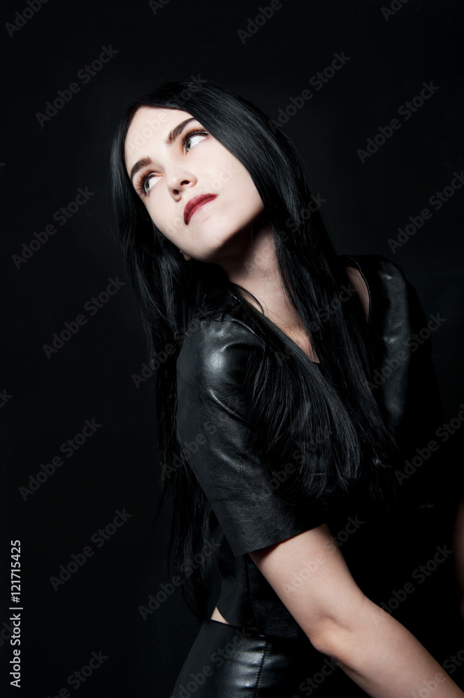 Gorgeous brunette with white skin, red lips on black backdrop Gorgeous brunette with white skin, red lips on black backdrop