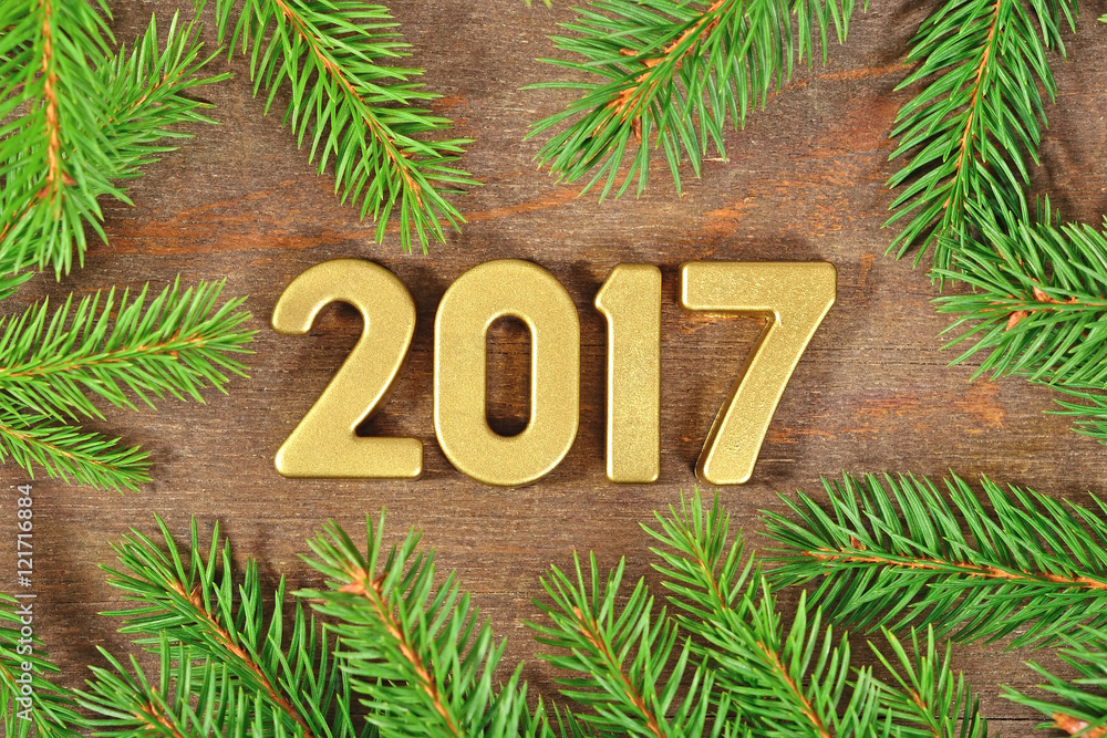 2017 year golden figures and a spruce branch 2017 year golden figures and a spruce branch