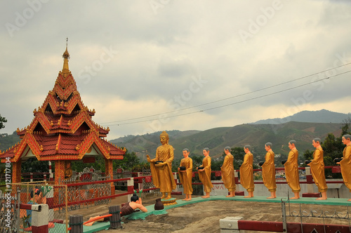 Statues of Buddha and followers at Shwe Dagon temple, Tachilek, Myanmar
