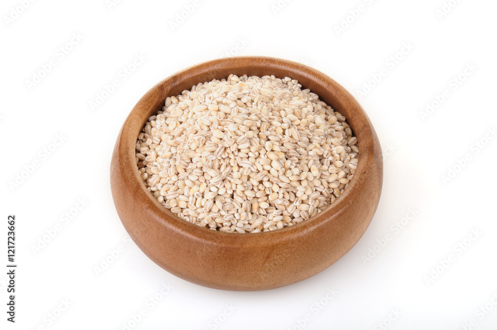 pearl barley in a wooden bowl. for healthy cooking ingredient pearl barley in a wooden bowl. for healthy cooking ingredient