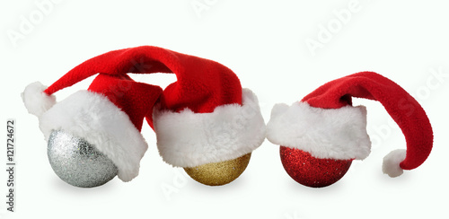 Christmas balls in caps of Santa Claus. Christmas decorations