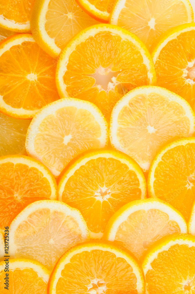 citrus background. juicy slices of lemon and orange cover the entire surface. citrus background. juicy slices of lemon and orange cover the entire surface.