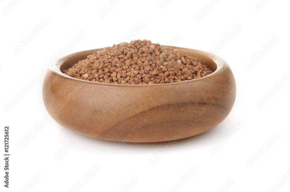 Buckwheat in a wooden bowl. for healthy cooking ingredient Buckwheat in a wooden bowl. for healthy cooking ingredient
