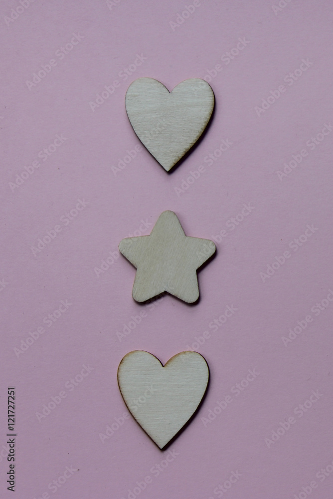 Wooden Christmas, Wedding or Valentine favors on a pink background