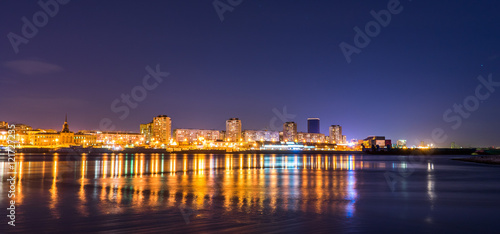 Night city on the river Enisey photo