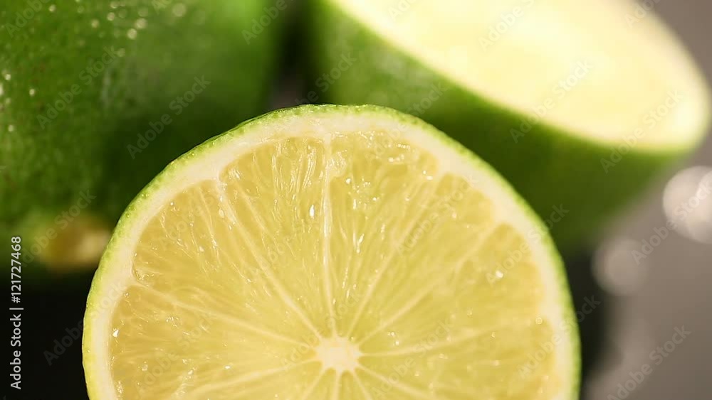 Green lime cut before squeezing refreshing energetic juice, healthy lifestyle Green lime cut before squeezing refreshing energetic juice, healthy lifestyle