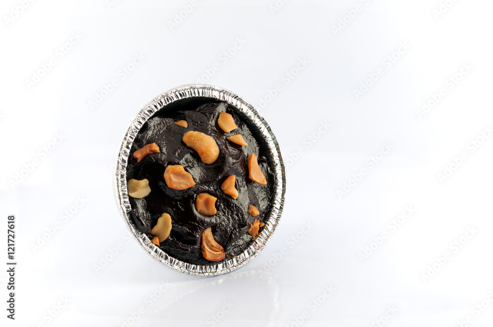 Brownie with peanuts chips topping in lefroy paper cup. Brownie with peanuts chips topping in lefroy paper cup.