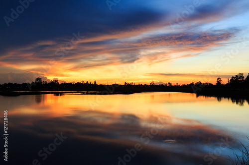 Sunset landscape with sky at the calm lake