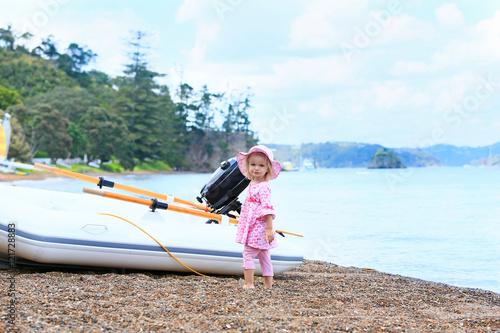 Little girl in pink dress. Russell Long Beach, Bay of islands. NZ
