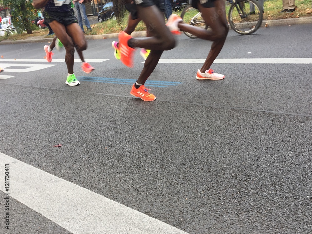 Berlin, Germany - September 25, 2016: marathon runners legs Berlin, Germany - September 25, 2016: marathon runners legs