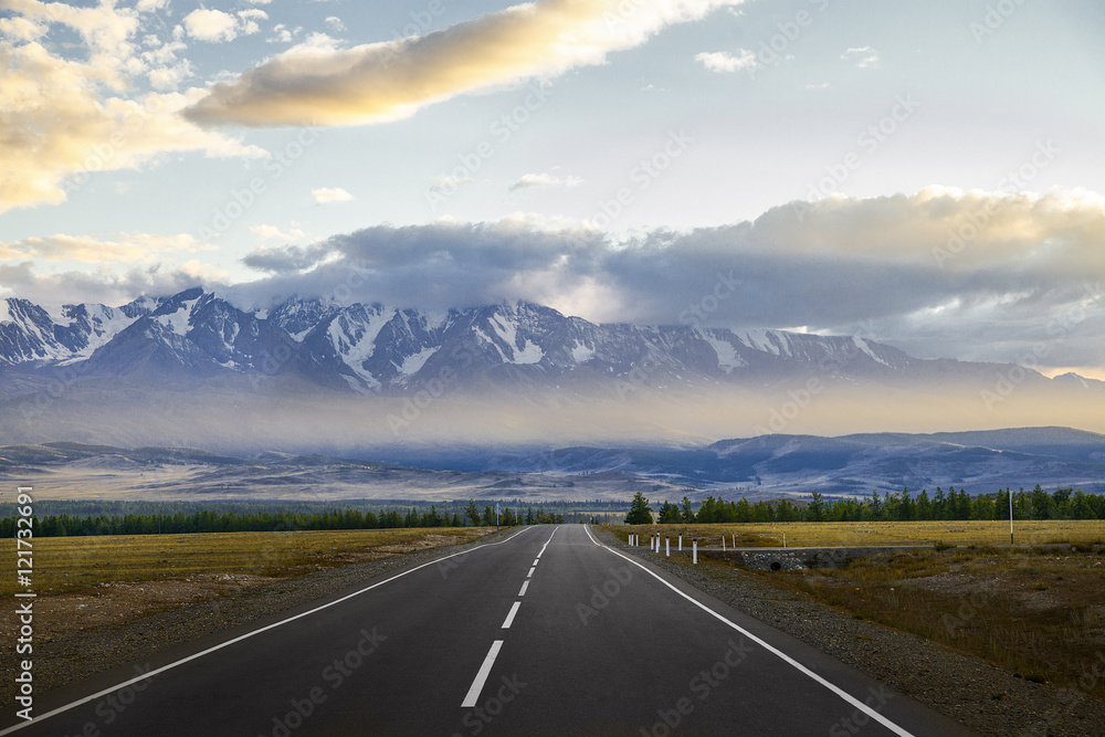 Straight empty highway to the mountains. Altay region, Russia. Straight empty highway to the mountains. Altay region, Russia.
