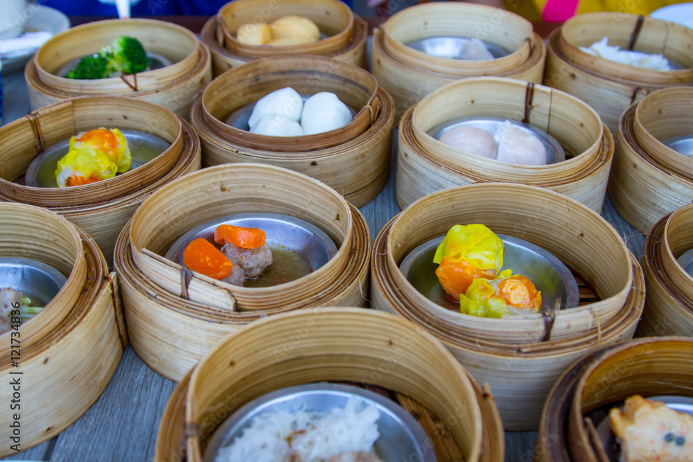various dim sum in bamboo steamer in chinese restaurant various dim sum in bamboo steamer in chinese restaurant