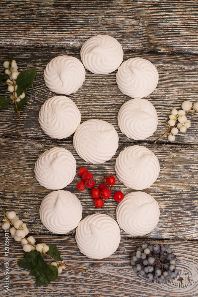 marshmallows with berries on wooden table. number 8 marshmallows with berries on wooden table. number 8