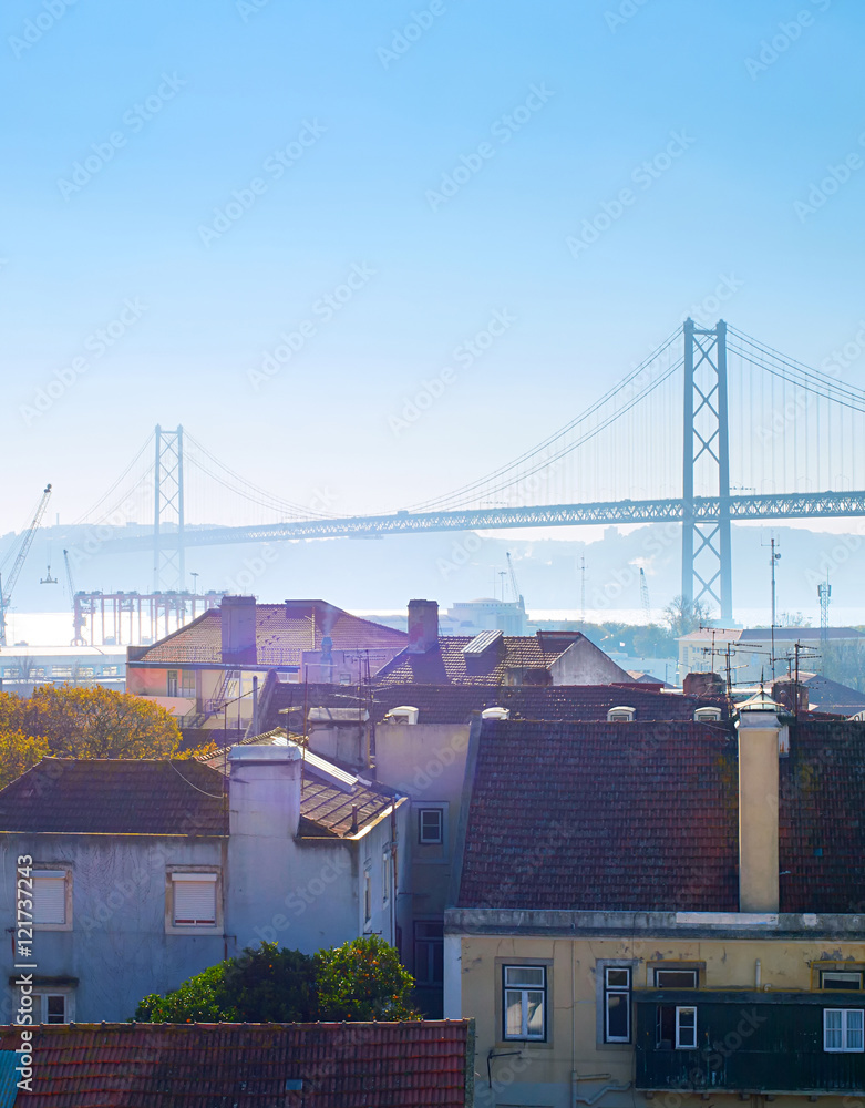 Naklejka premium Lisbon buildings and bridge, Portugal
