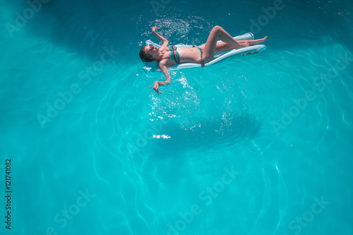 Young woman relaxing in pool