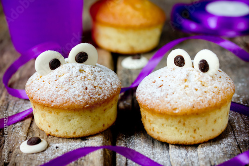 Halloween funny monster muffins with chocolate eyes photo