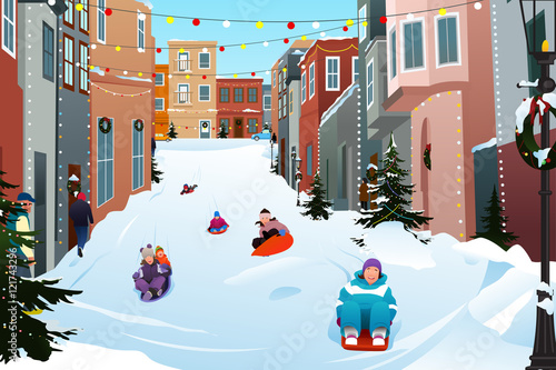 Kids Sledding on a Snowy Street During Winter Season