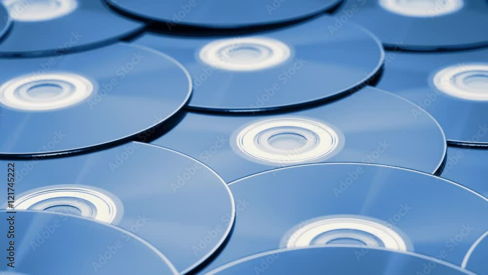 dolly tracking shot over a pile of digital versatile discs dolly tracking shot over a pile of digital versatile discs