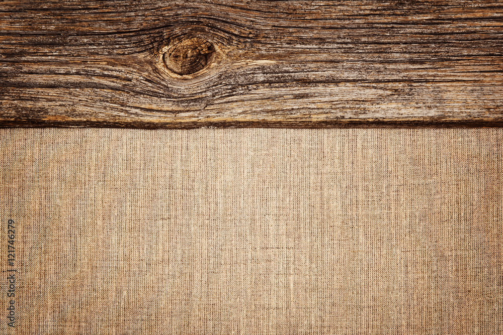 Linen background with wooden plank texture and vignette Linen background with wooden plank texture and vignette