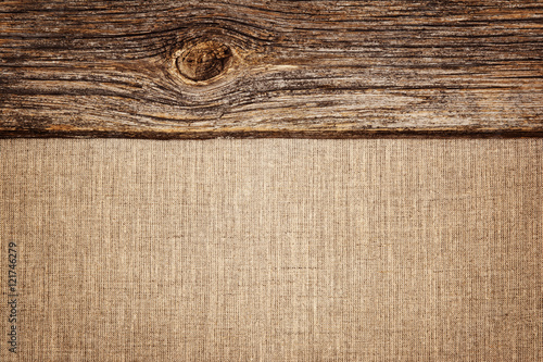 Linen background with wooden plank texture and vignette