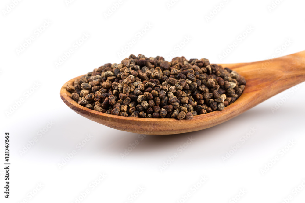 Decorticated cardamom seeds in a wooden spoon Decorticated cardamom seeds in a wooden spoon