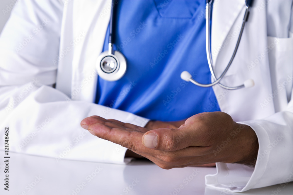 Doctor in consultation with hands in position Doctor in consultation with hands in position