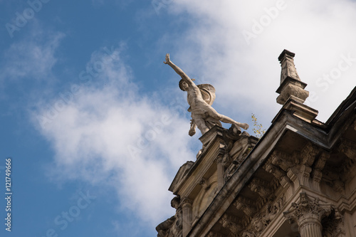 statue on the top of the building in Europe