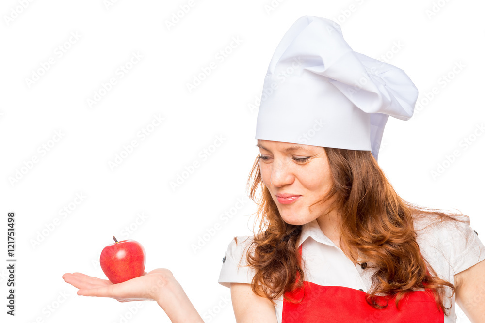 female cook with red apple on a white background female cook with red apple on a white background