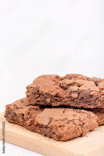 Chocolate brownies over white background.
