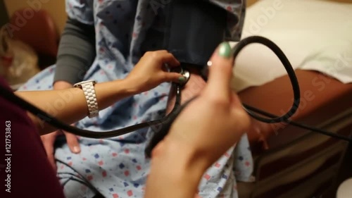 Nurse Checking Patient's Blood Pressure 