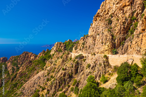 Calanques de Piana with the D81 coastline road on the west coast of Corsica, France