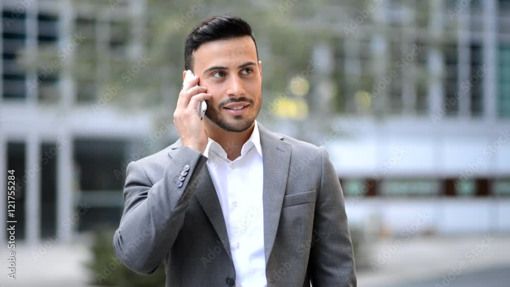 Young manager talking on the phone outdoor Young manager talking on the phone outdoor