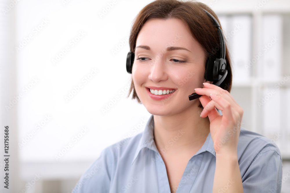 Young beautiful business woman in headset. Call center. Young beautiful business woman in headset. Call center.
