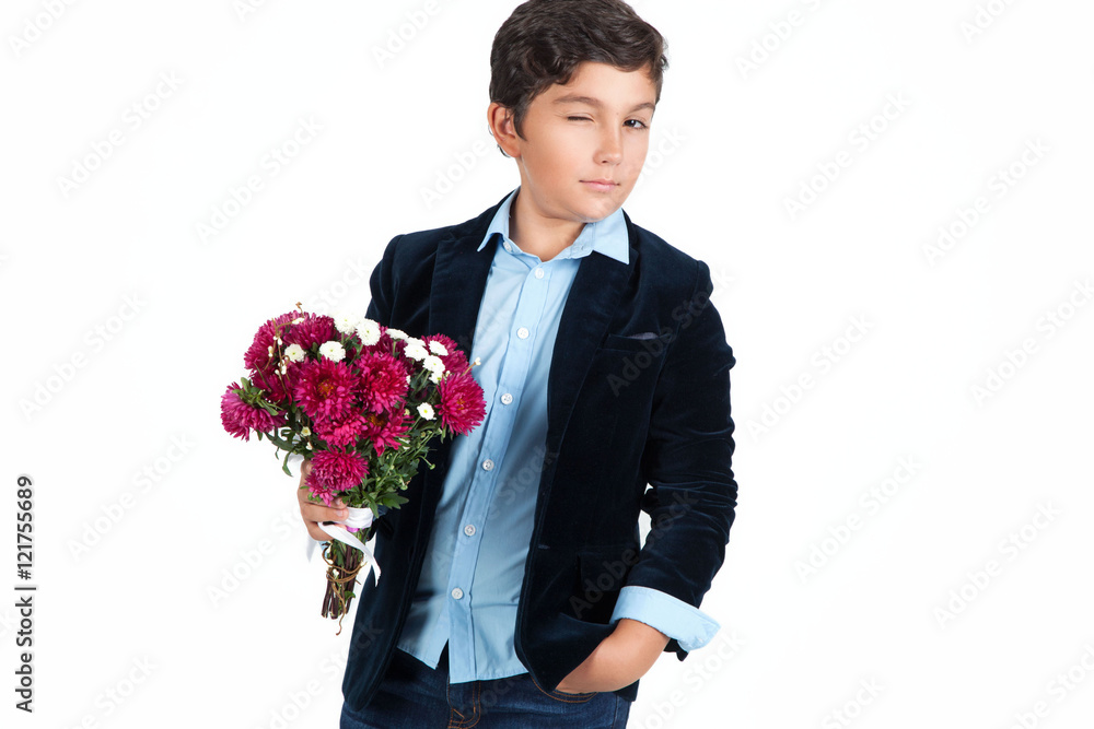 Young little boy with flowers over white background. Young little boy with flowers over white background.