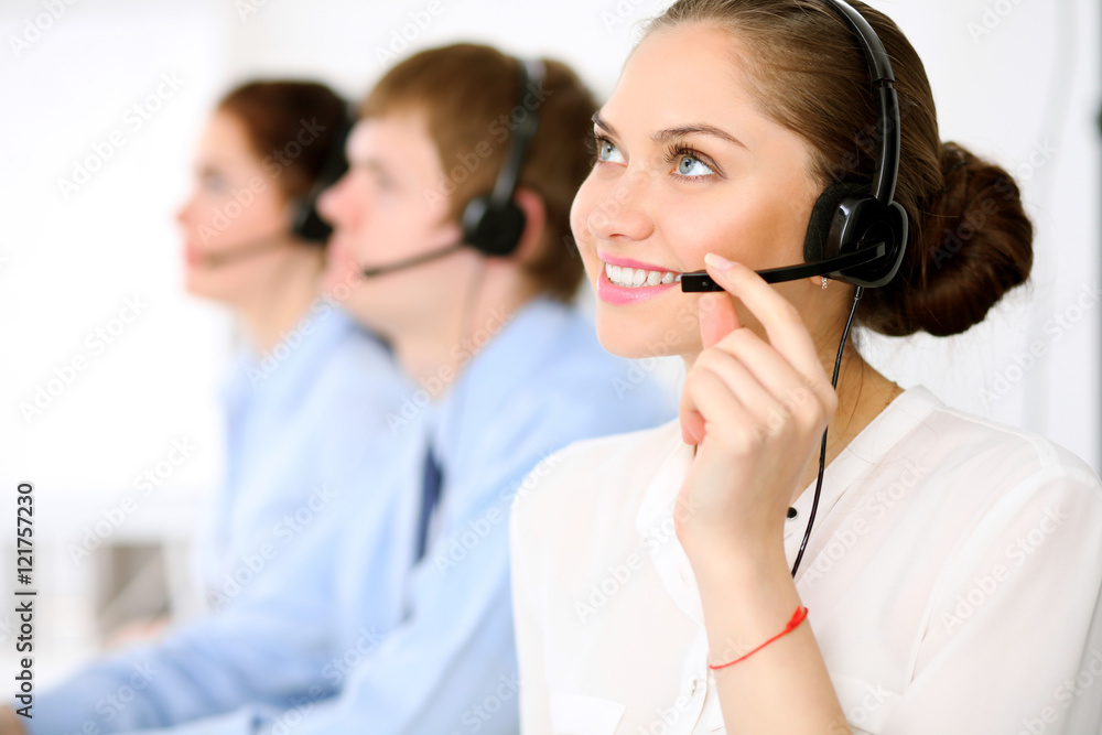 Call center operators. Young beautiful business woman in headset. Call center operators. Young beautiful business woman in headset.
