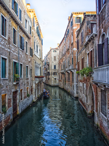 Venice canal with gondolieri