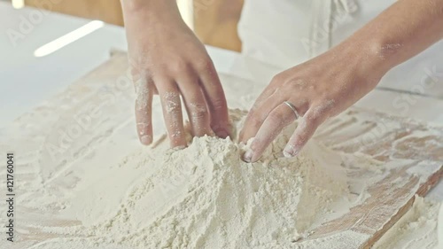Boy cooking, mixing, and making mess. Isolated in wood house
