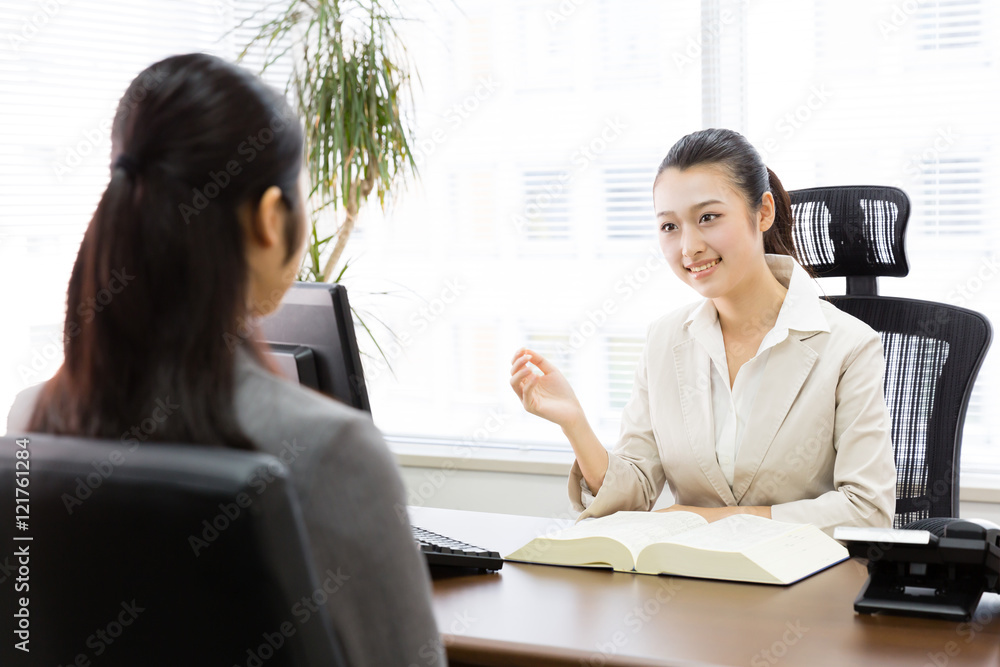 asian businesswomen talking in the modern office asian businesswomen talking in the modern office
